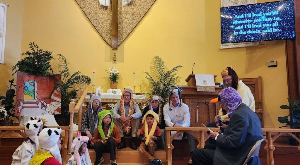 Children and adults taking part in an intergenerational church activity